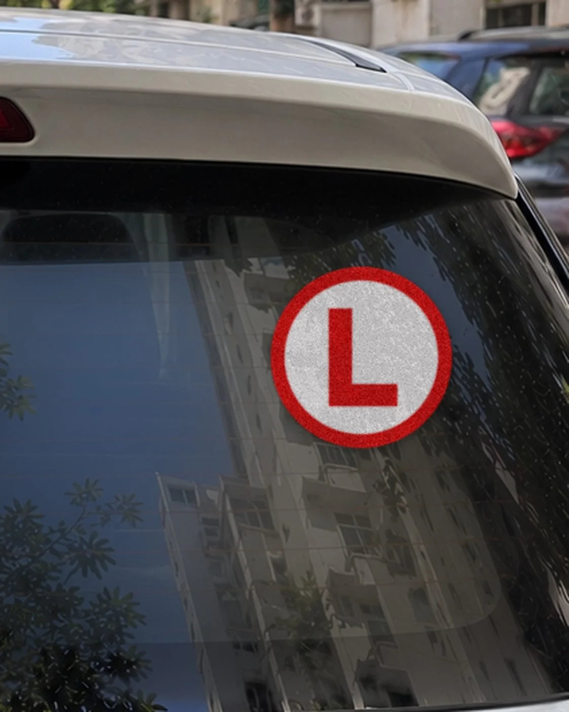 Learner L car patch on a car