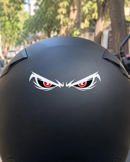 Angry Eyes bike patch in white ink on a helmet