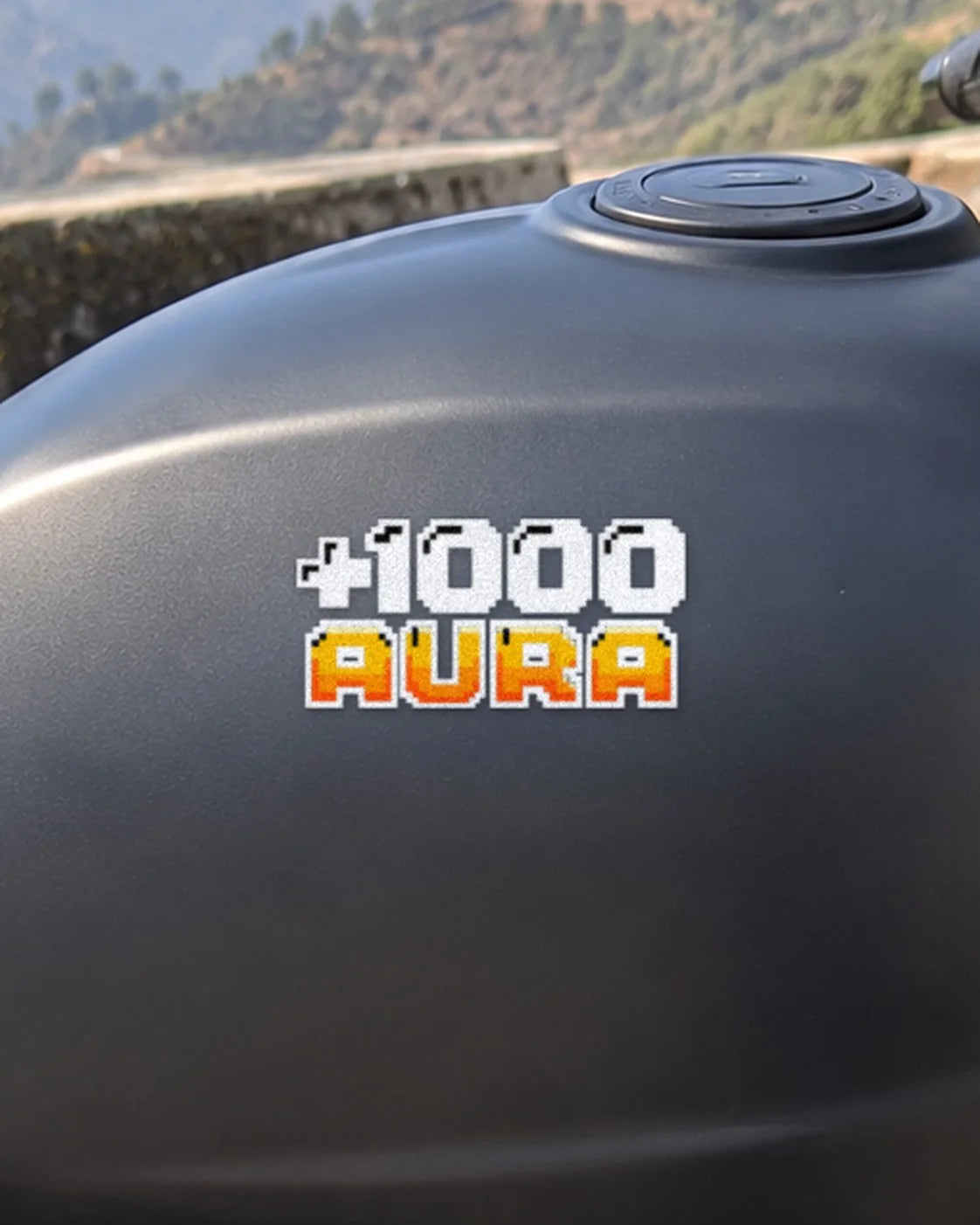 +1000 Aura bike patch in white ink on a bike