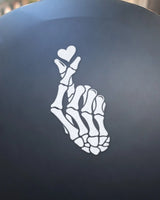 Bone Heart bike patch in white ink on a helmet
