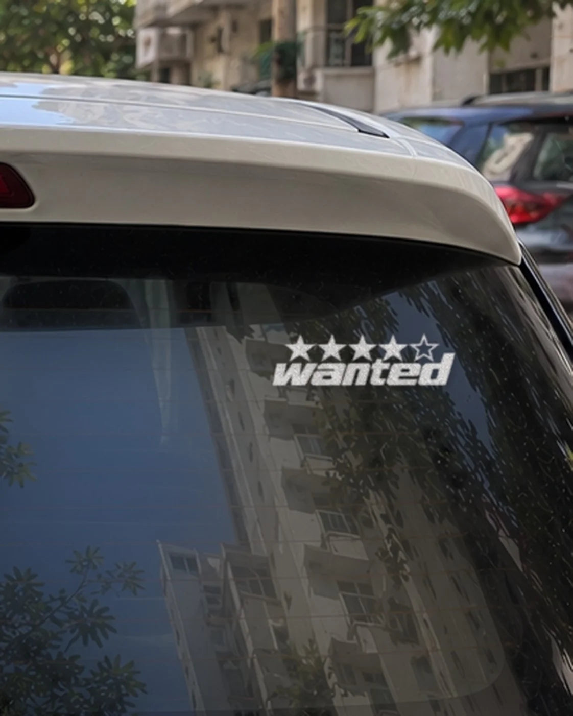Wanted car patch in white on a car