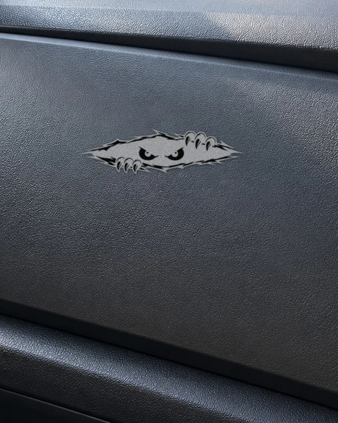 Peeking Eyes car patch in white on a car