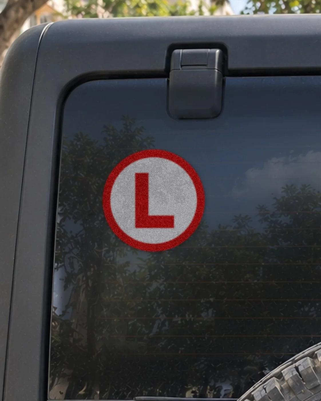 Learner L car patch on a car