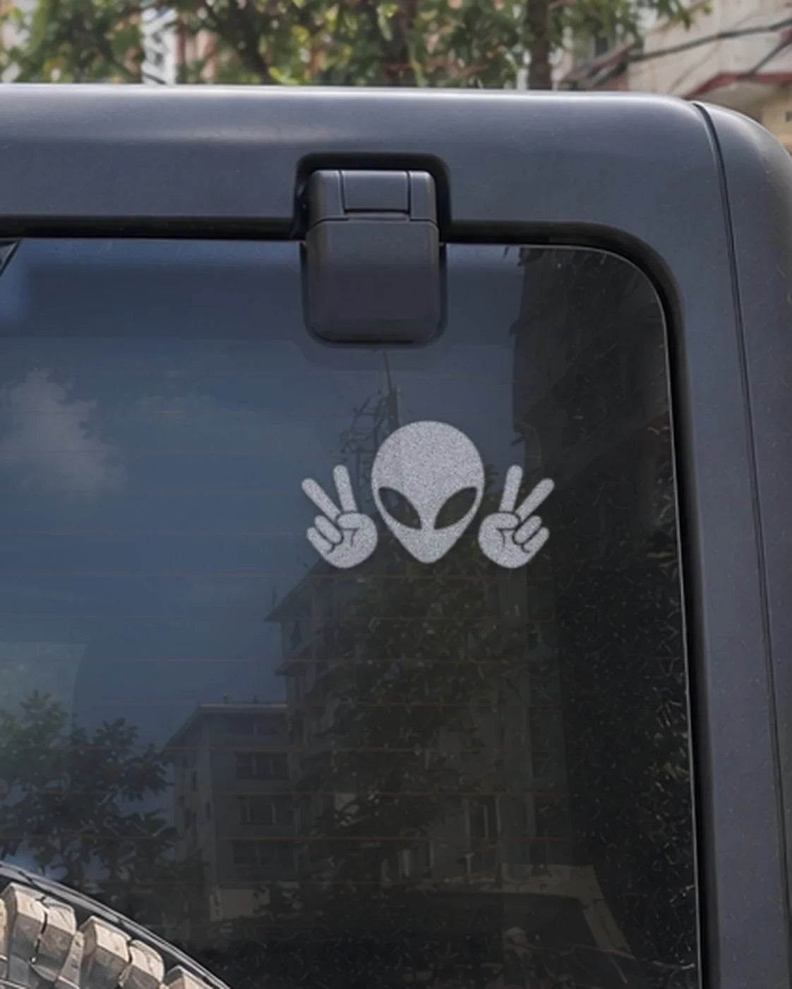 Peace Alien car patch in white on a car