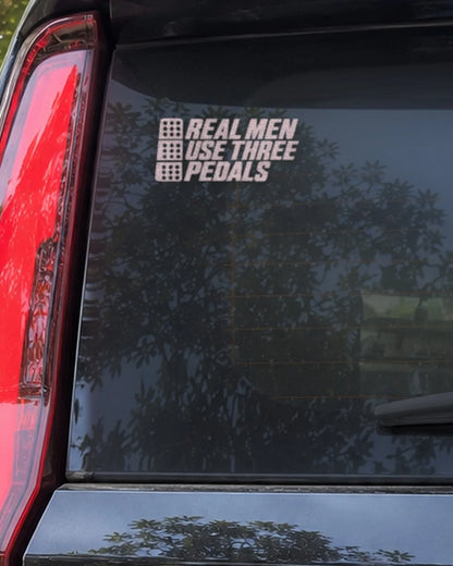 Three Pedals car patch in white on a car