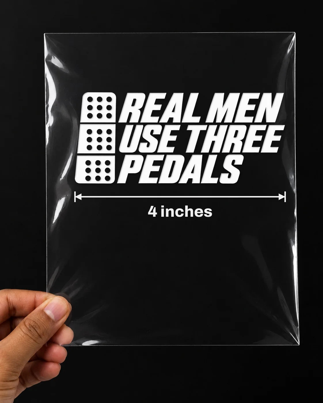 Three Pedals car patch in white on a car