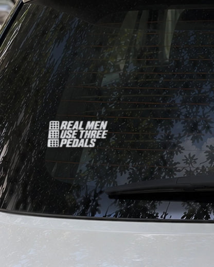 Three Pedals car patch in white on a car