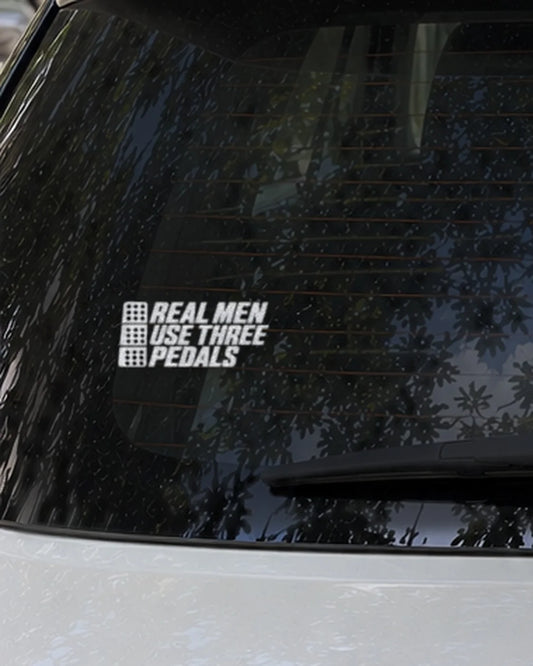 Three Pedals car patch in white on a car