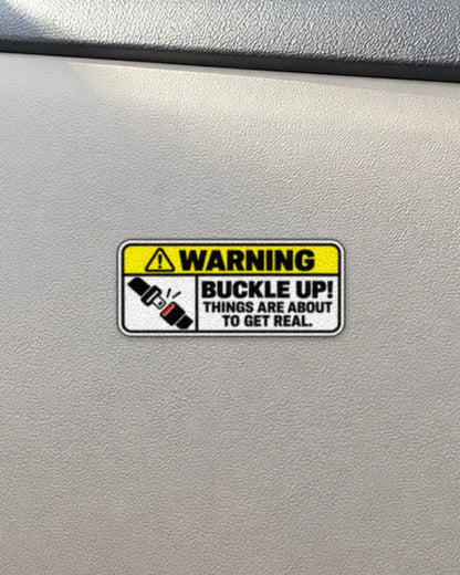Buckle Up Warning car patch on a car