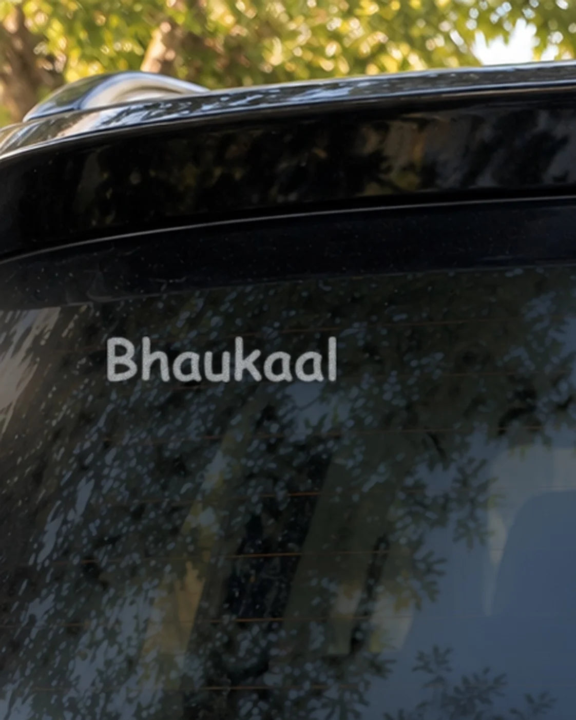 Custom white text on a car rear glass