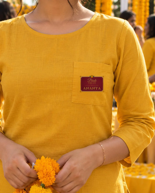 Bride Squad name patch on the chest pocket of a haldi kurta