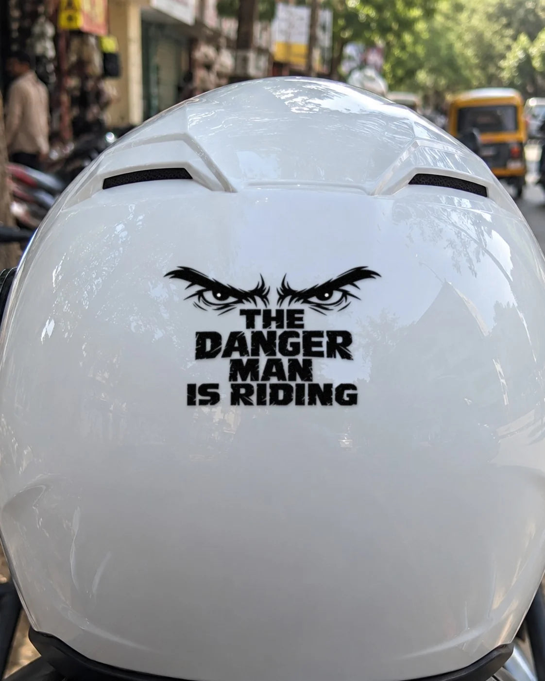 Danger Man Riding bike patch in black ink on a helmet