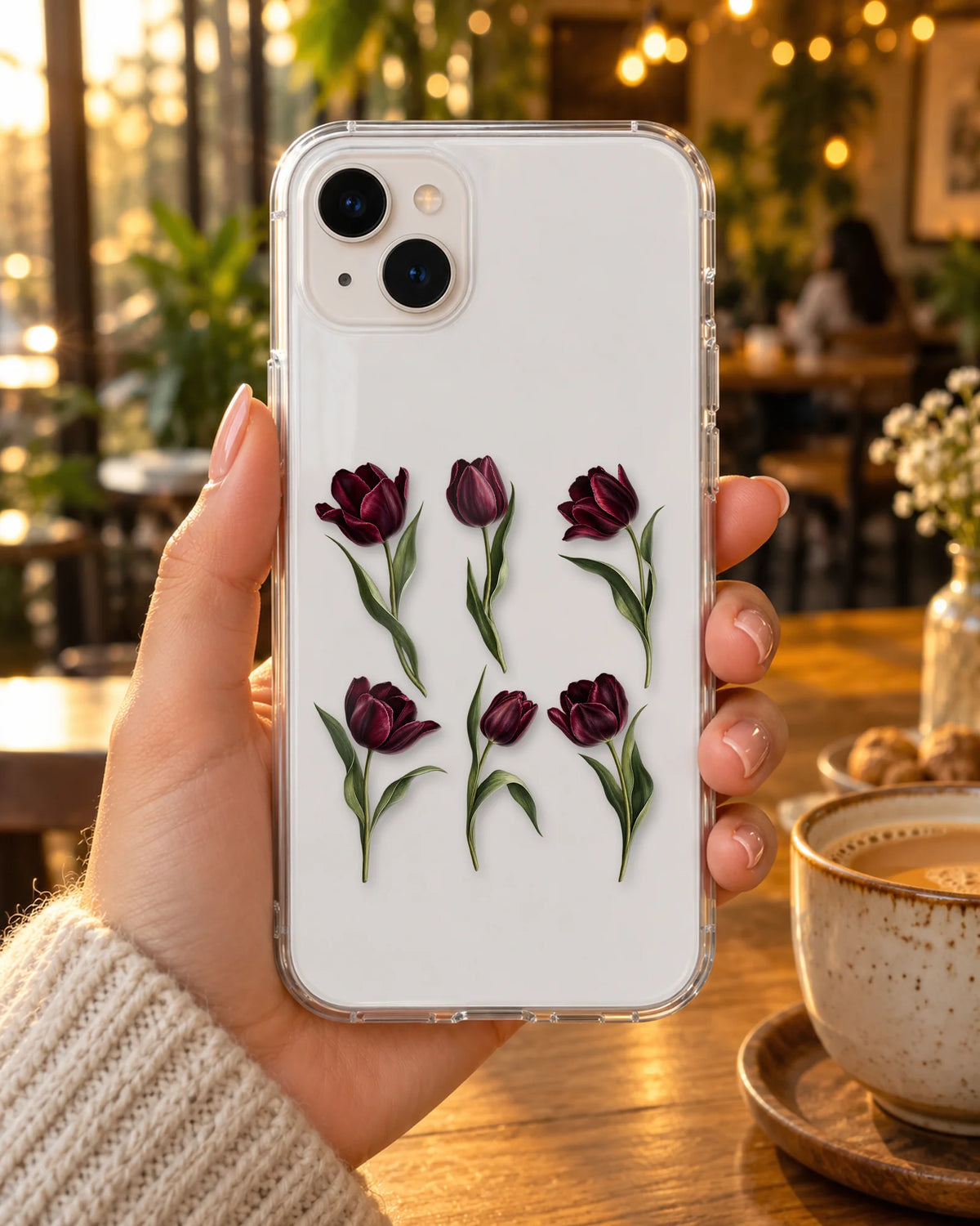 Dark Tulips on a phone at a cafe