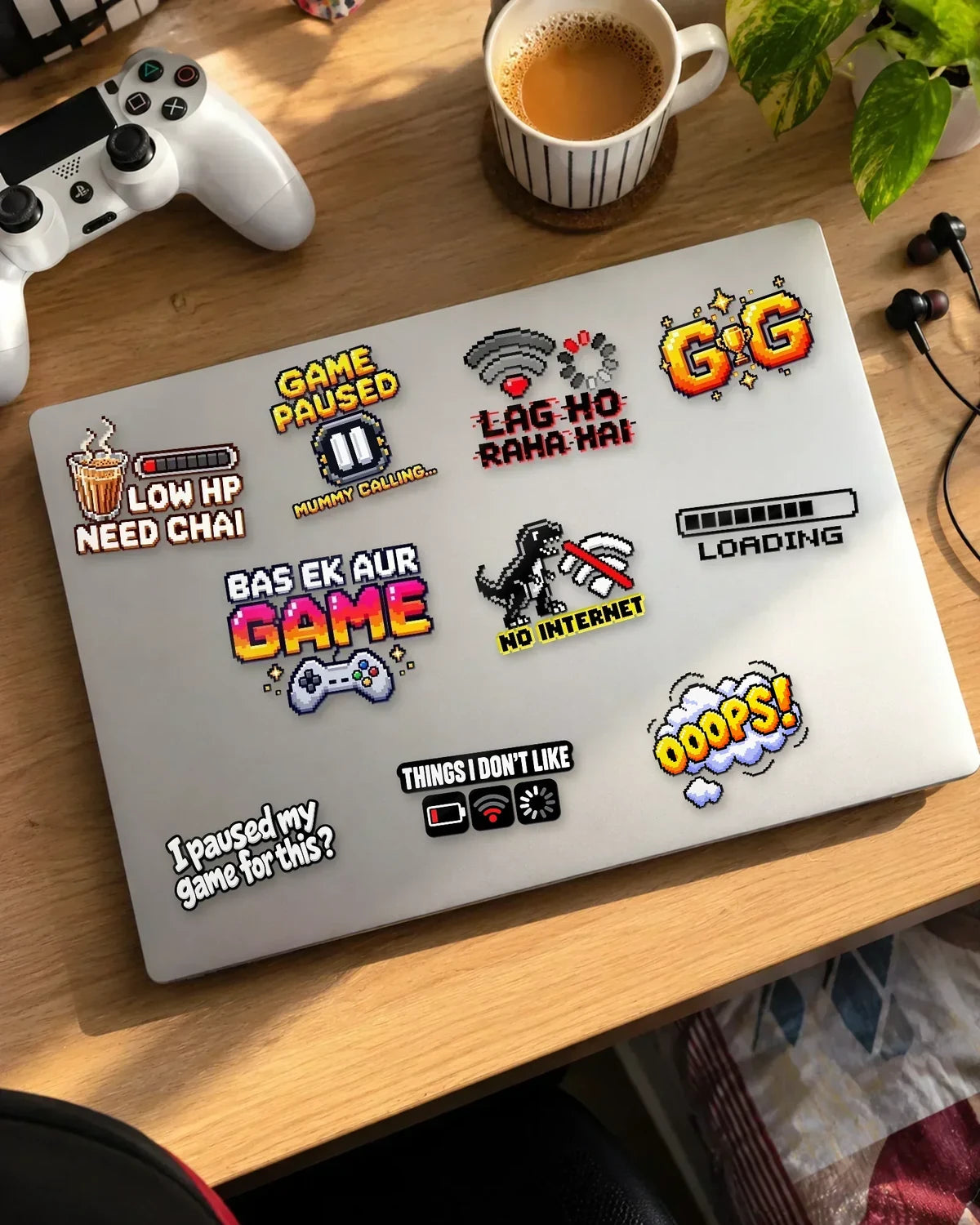 Desi Gamer Pack in black ink: 10 gamer patches on a white laptop
