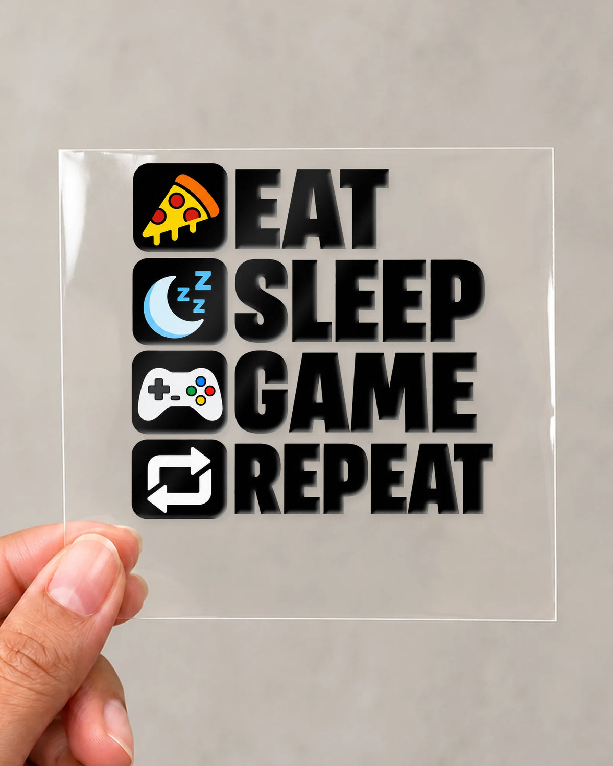 Eat Sleep Game Repeat gamer patch in black ink on clear film