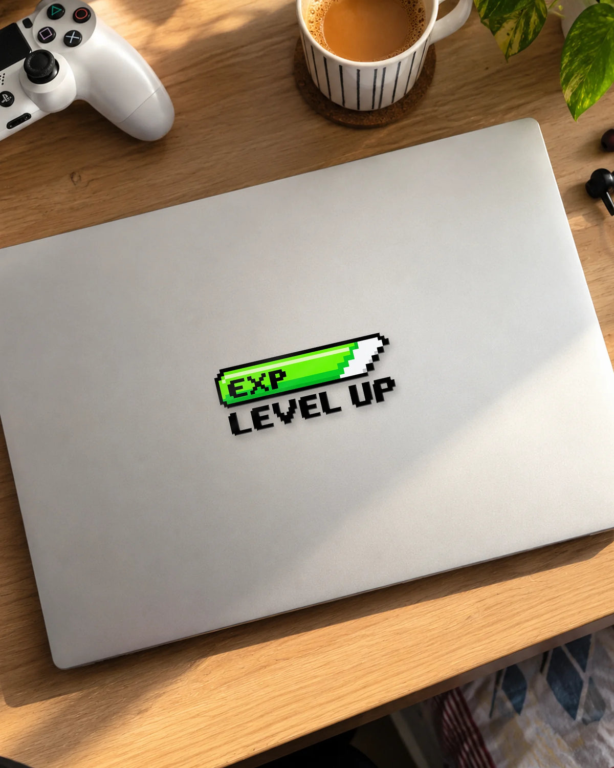 EXP Level Up gamer patch in black ink on a laptop