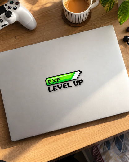 EXP Level Up gamer patch in black ink on a laptop