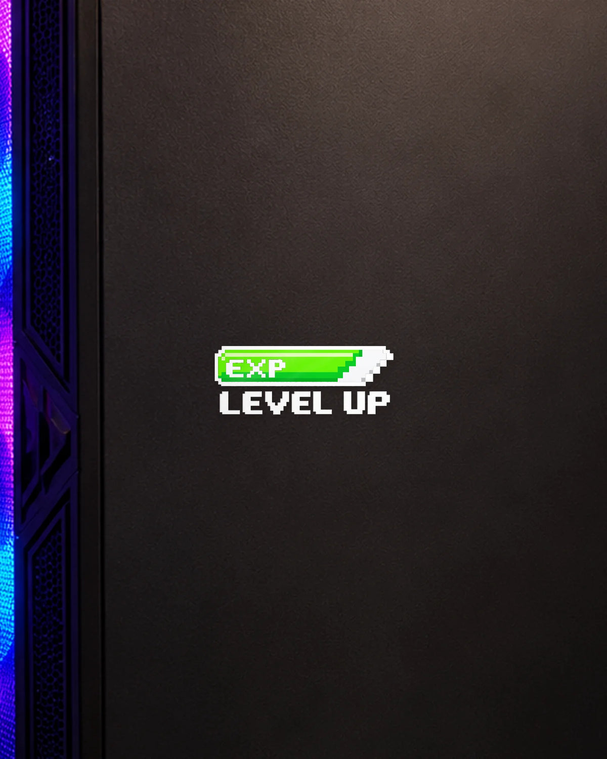 EXP Level Up gamer patch in white ink on a gaming PC cabinet