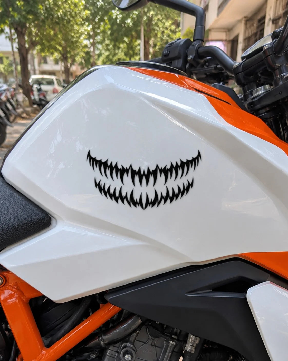 Fang Grill bike patch in black ink on a bike