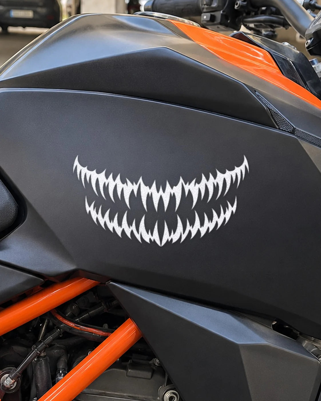 Fang Grill bike patch in white ink on a bike