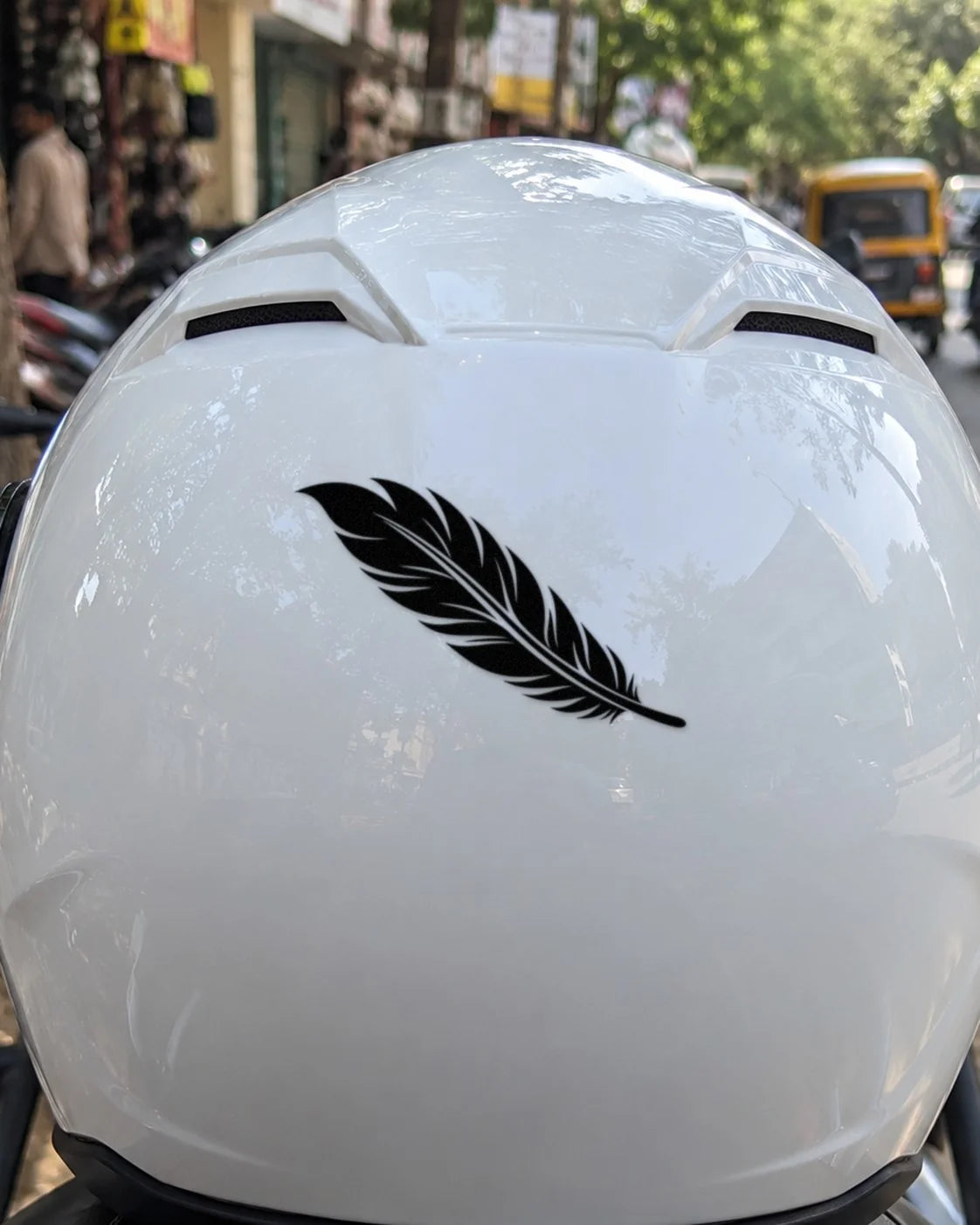 Free Feather bike patch in black ink on a helmet