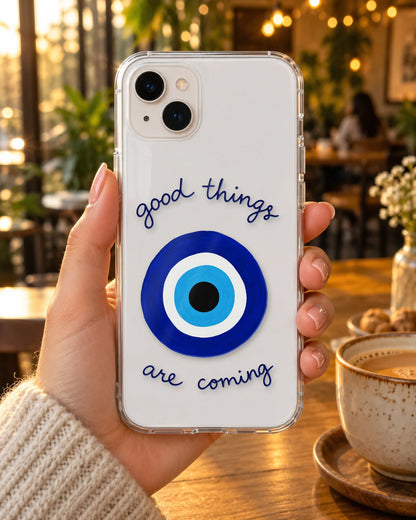 Good Things on a phone at a cafe
