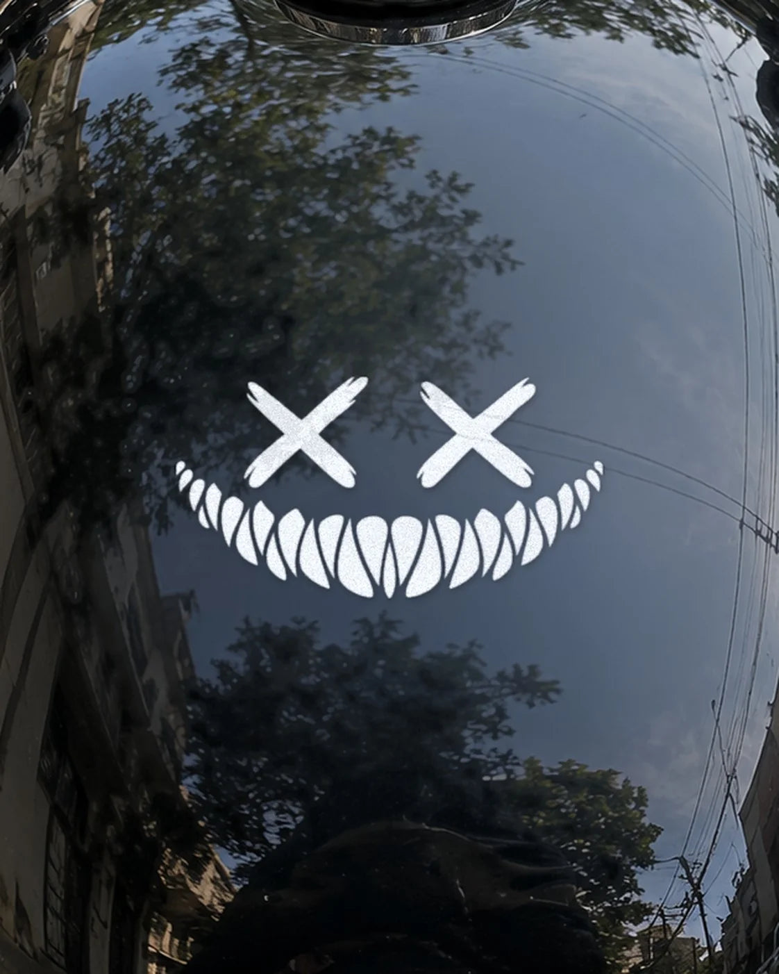 Grin Reaper bike patch in white ink on a bike