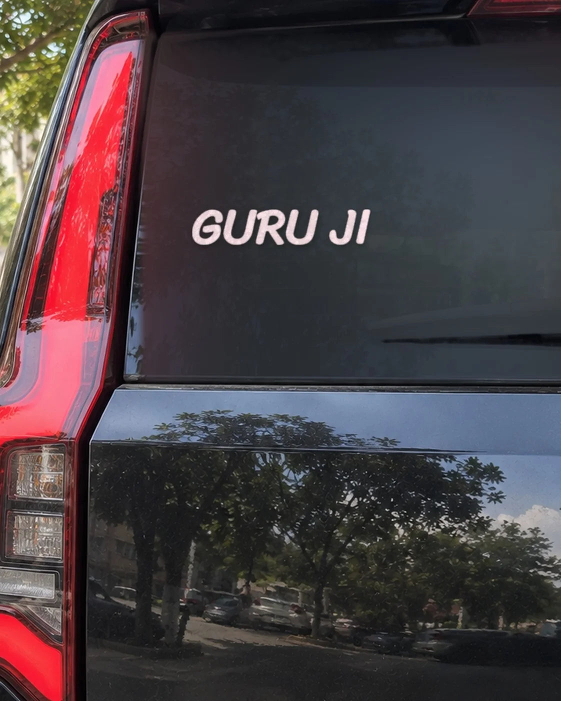 Guruji car patch on a car rear glass