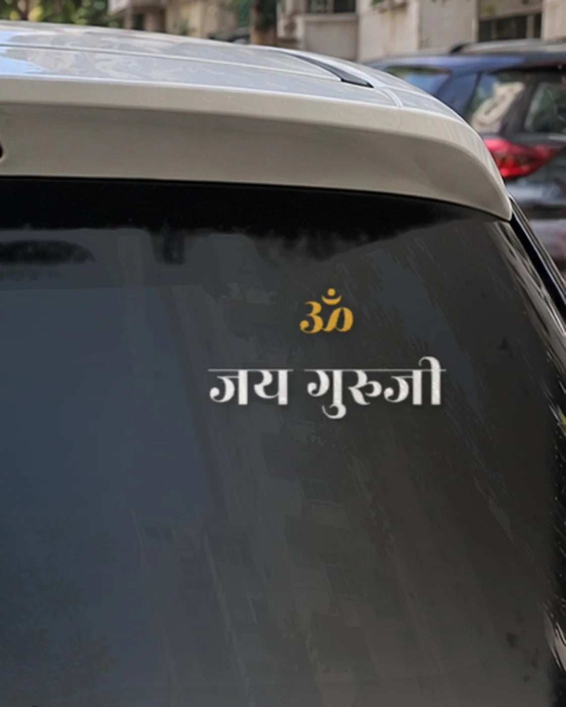 Guruji car patch on a car rear glass