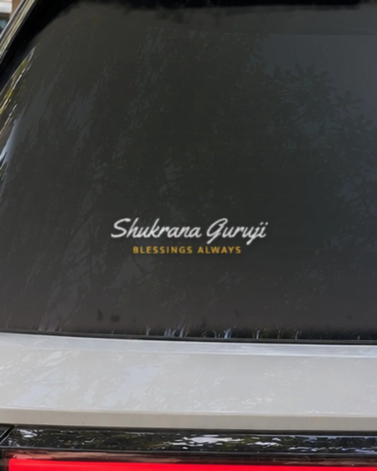 Guruji car patch on a car rear glass