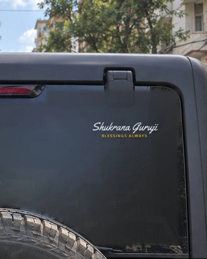 Guruji car patch on a car rear glass