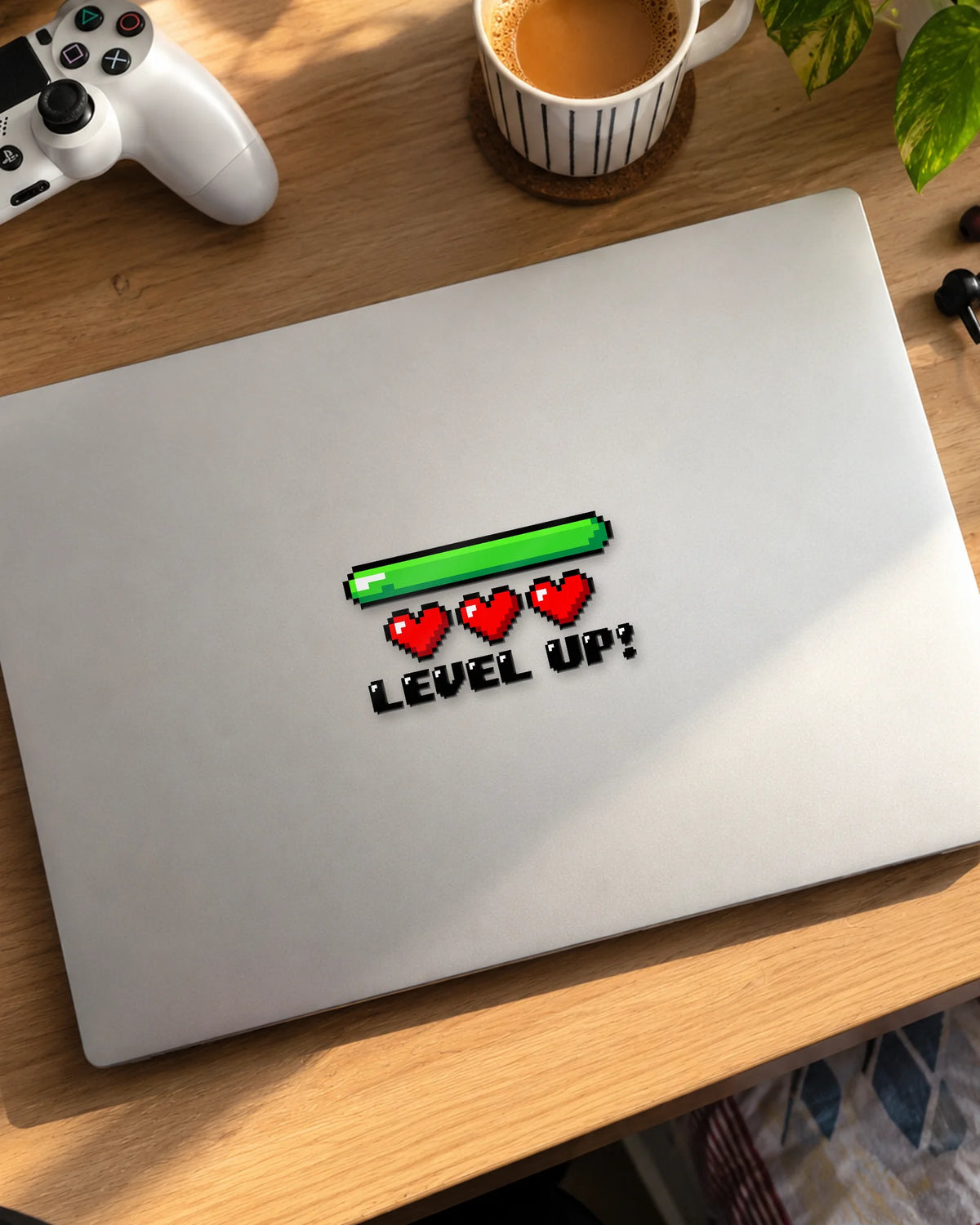 Level Up gamer patch in black ink on a laptop