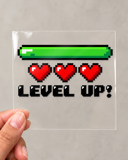 Level Up gamer patch in black ink on clear film