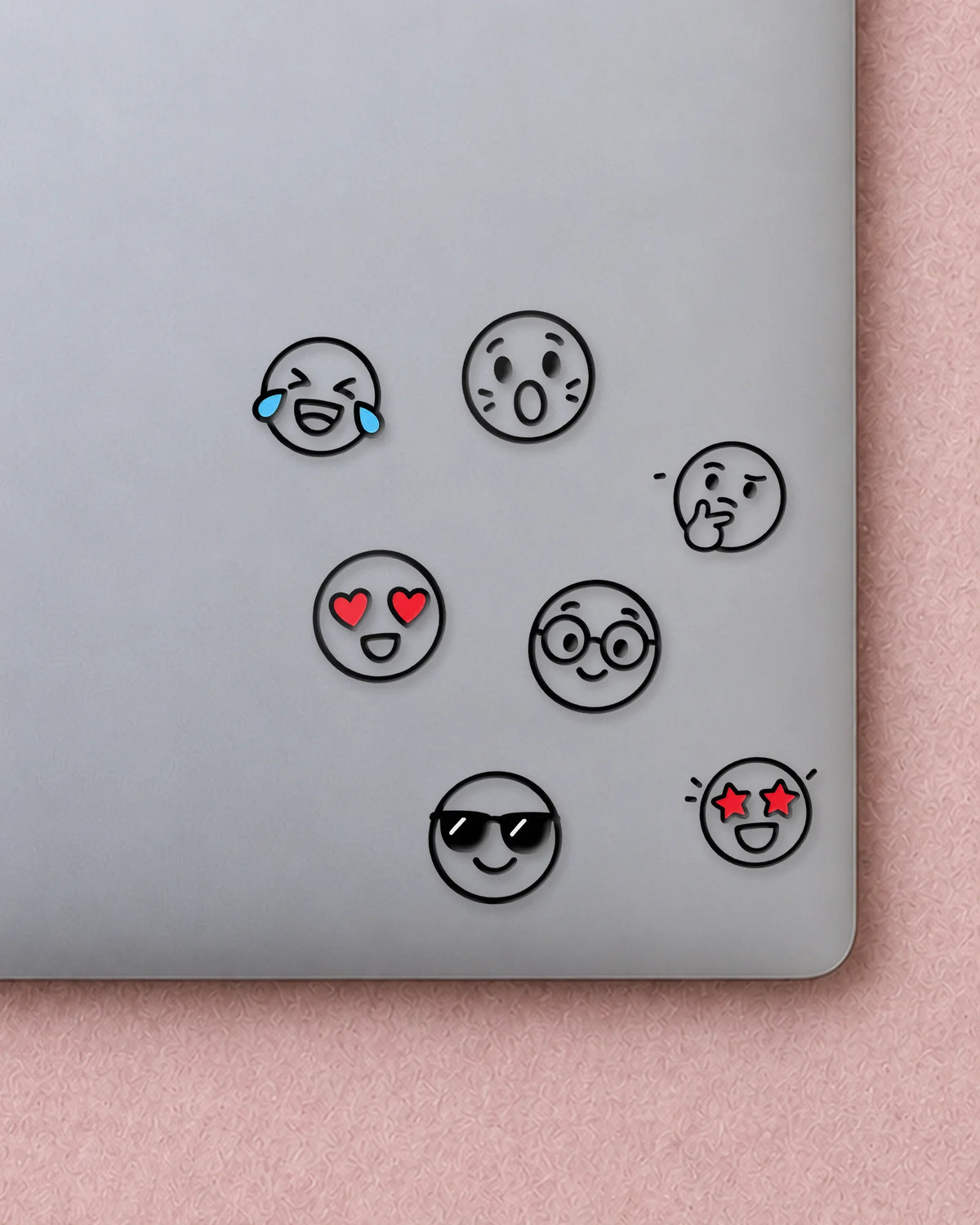 Line Emojis mini patches on a laptop