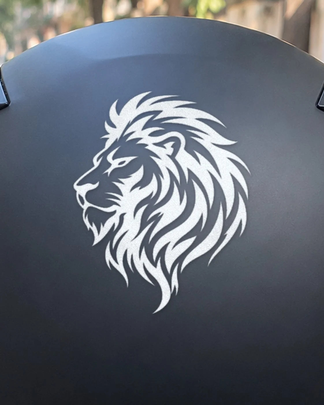 Lion Heart bike patch in white ink on a helmet