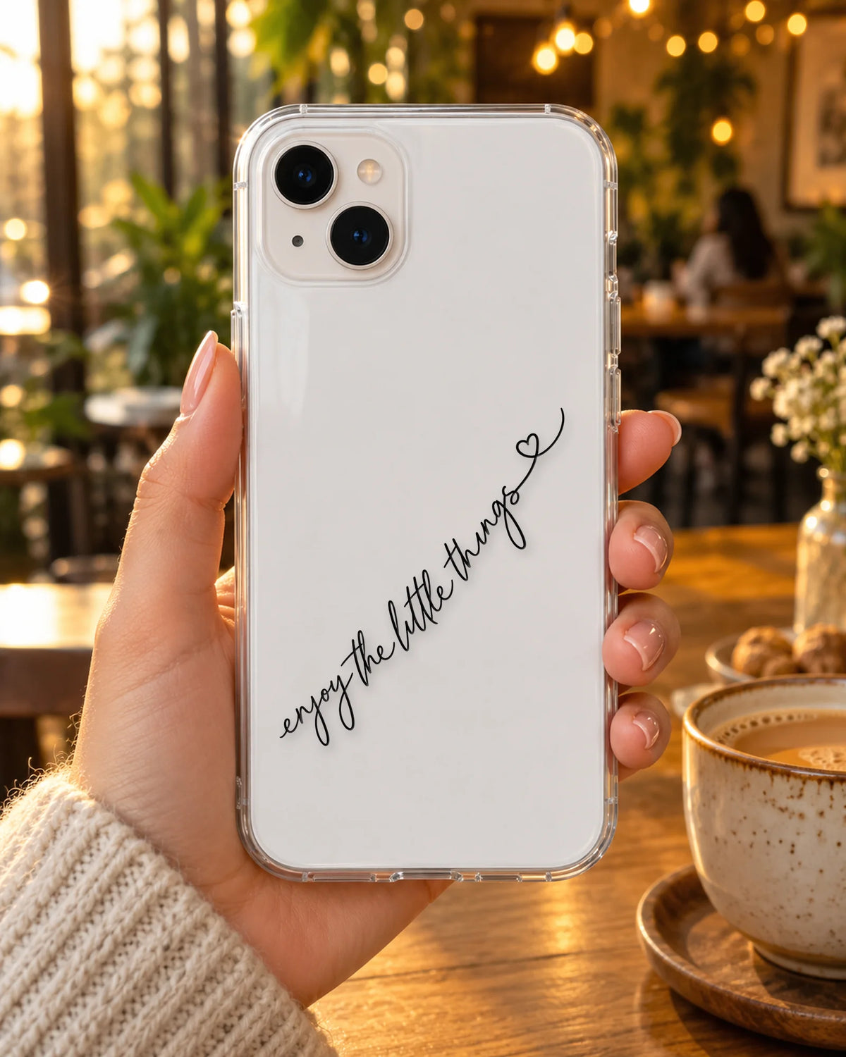 Little Things on a phone at a cafe