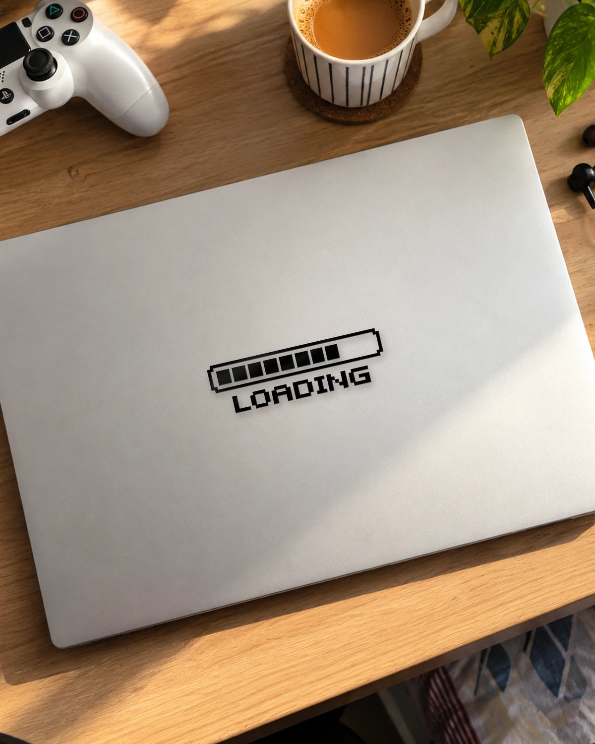 Loading gamer patch in black ink on a laptop