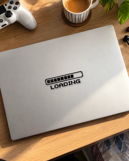 Loading gamer patch in black ink on a laptop