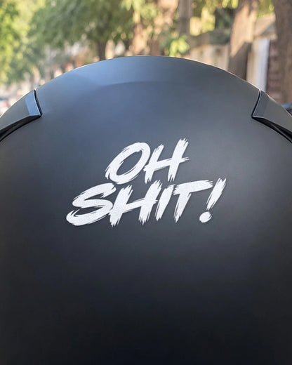 Oh Shit! bike patch in white ink on a helmet