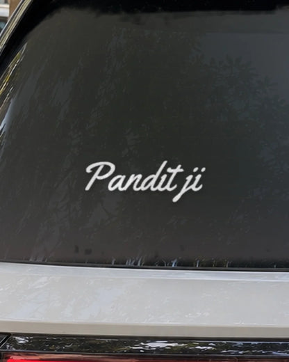Pandit Ji car patch on a car rear glass