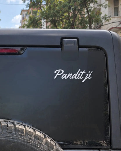Pandit Ji car patch on a car rear glass