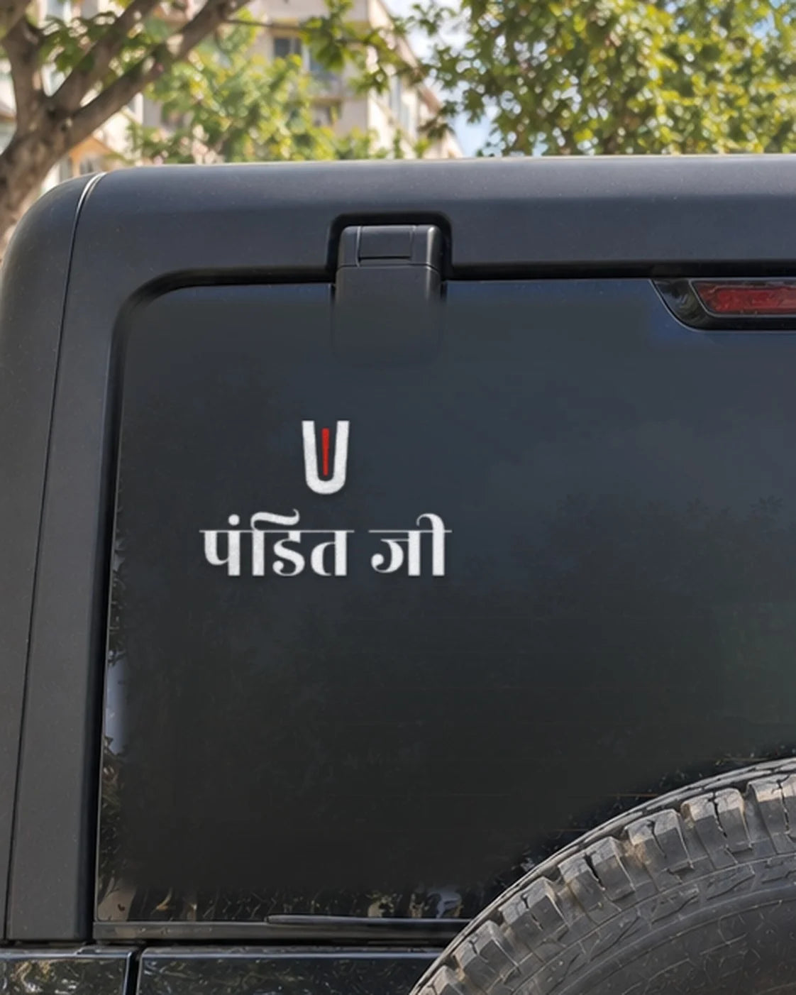 Pandit Ji car patch on a car rear glass