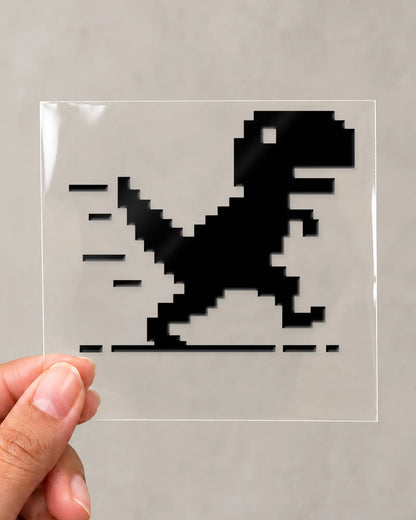 Pixel Dino gamer patch in black ink on clear film