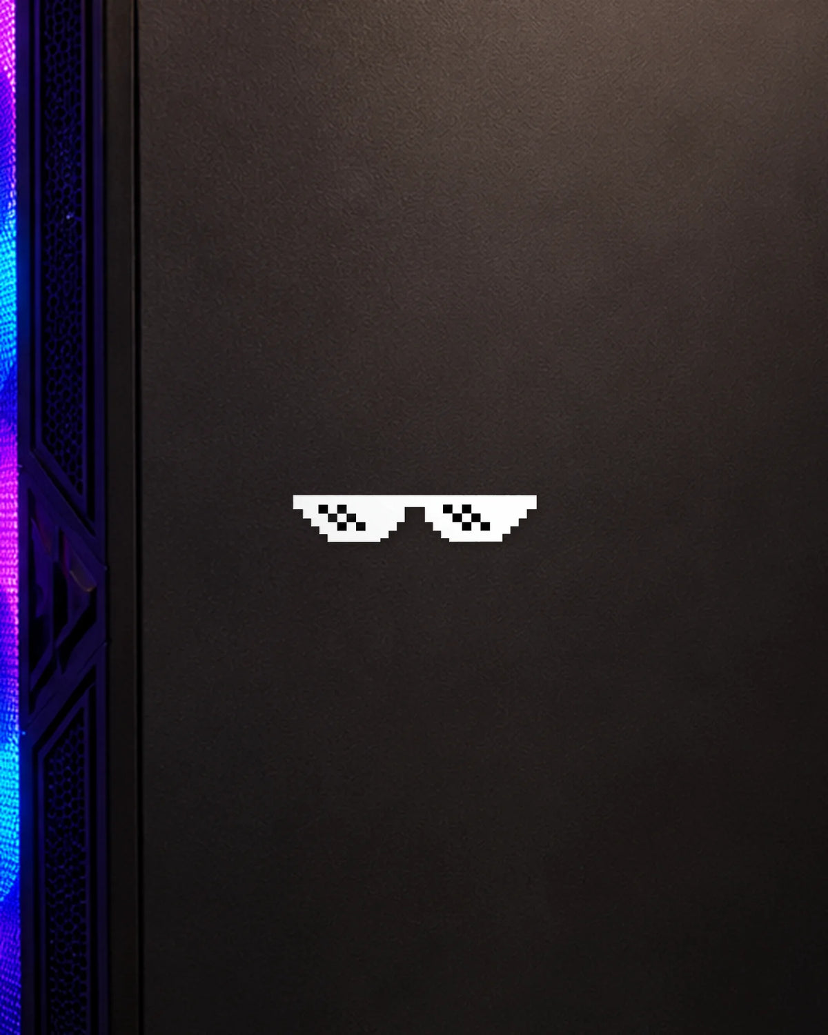 Pixel Shades gamer patch in white ink on a gaming PC cabinet