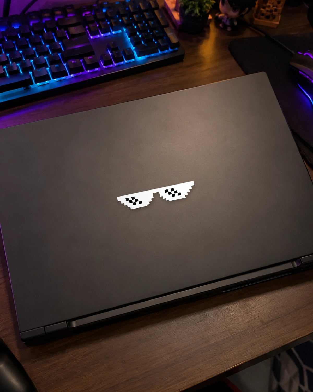 Pixel Shades gamer patch in white ink on a gaming laptop