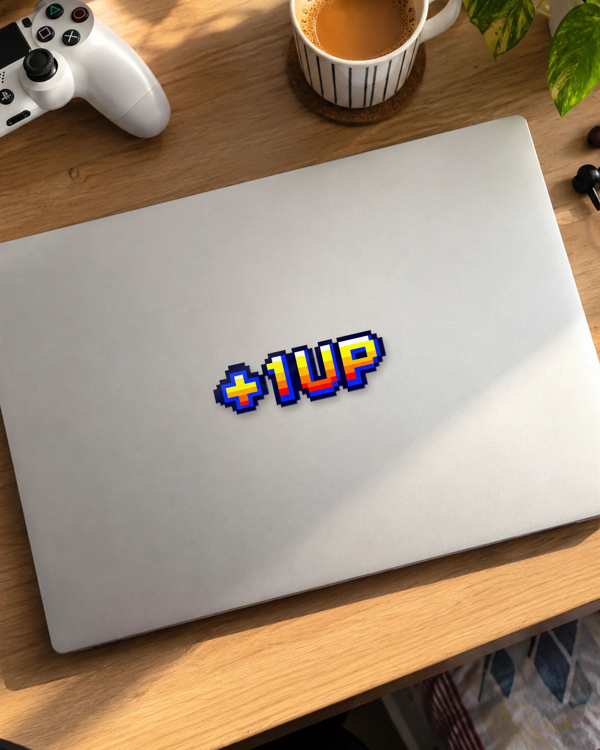 +1 UP gamer patch on a laptop