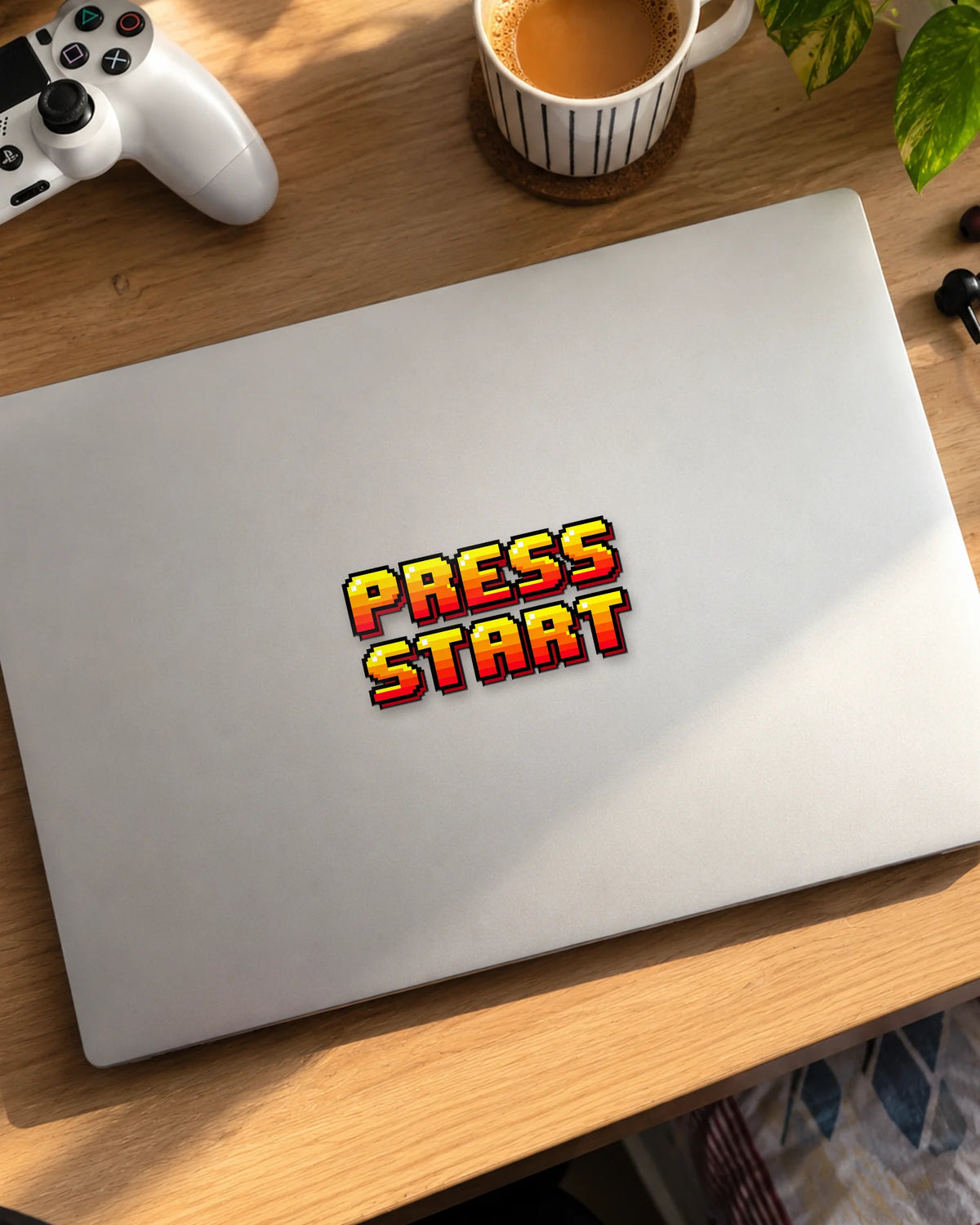 Press Start gamer patch on a laptop