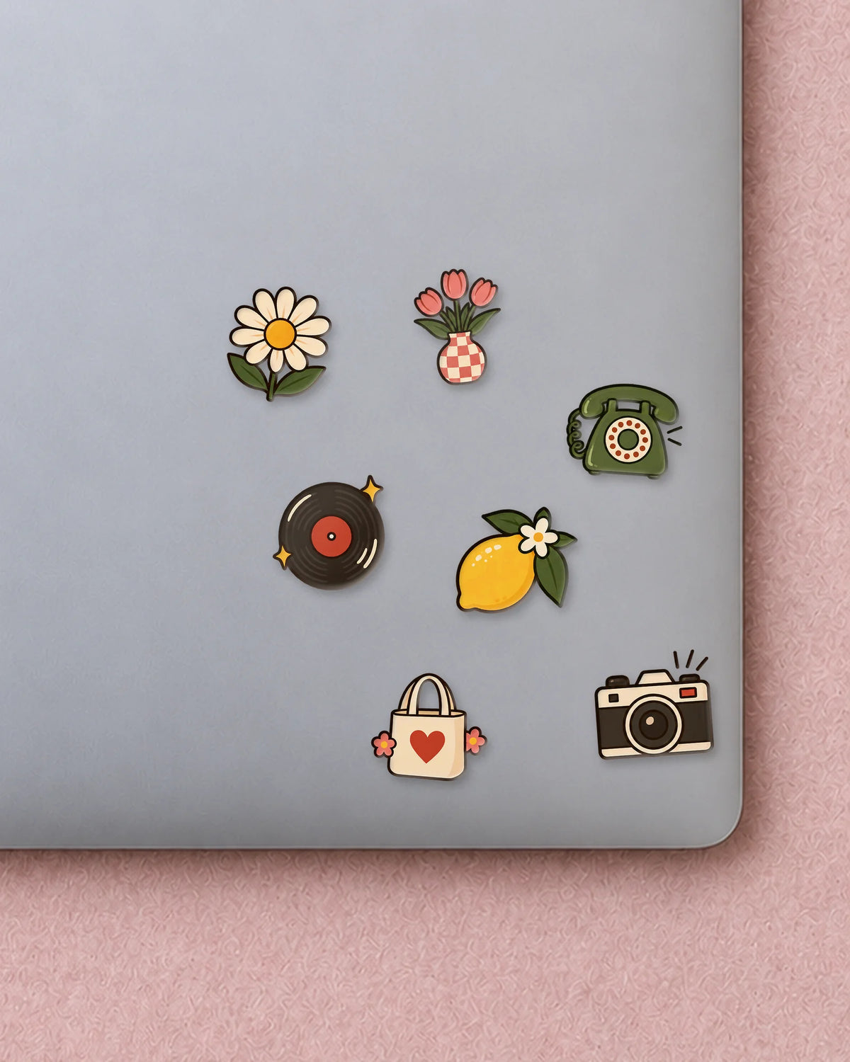 Retro Badges mini patches on a laptop
