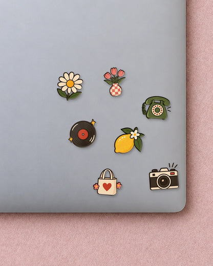 Retro Badges mini patches on a laptop