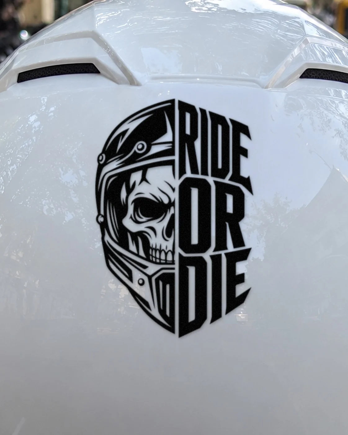 Ride or Die bike patch in black ink on a helmet